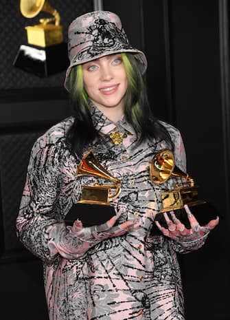 LOS ANGELES, CALIFORNIA - MARCH 14: Billie Eilish, winner of Record of the Year for 'Everything I Wanted' and Best Song Written For Visual Media for "No Time To Die", poses in the media room during the 63rd Annual GRAMMY Awards at Los Angeles Convention Center on March 14, 2021 in Los Angeles, California. (Photo by Kevin Mazur/Getty Images for The Recording Academy )