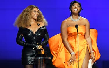 LOS ANGELES, CALIFORNIA - MARCH 14: (L-R) BeyoncÃ© and Megan Thee Stallion accept the Best Rap Performance award for 'Savage' onstage during the 63rd Annual GRAMMY Awards at Los Angeles Convention Center on March 14, 2021 in Los Angeles, California. (Photo by Kevin Winter/Getty Images for The Recording Academy)