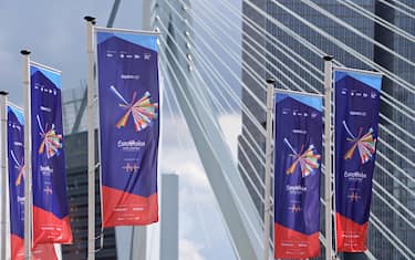 19 May 2021, Netherlands, Rotterdam: Flags with the logo of the Eurovision Song Contest (ESC) fly in front of the Erasmus Bridge, the KPN Tower and the skyscrapers De Rotterdam in the Wilhelminapier district. The final of the contest will take place on 22.05.2021. Photo: Soeren Stache/dpa-Zentralbild/dpa (Photo by Soeren Stache/picture alliance via Getty Images)