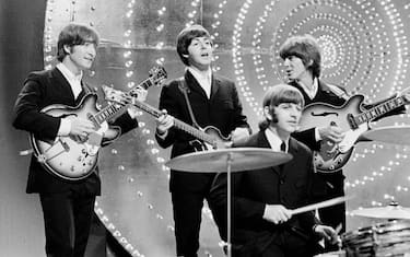LONDON - 16th JUNE: The Beatles perform 'Rain' and 'Paperback Writer' on BBC TV show 'Top Of The Pops' in London on 16th June 1966. Left to right: John Lennon (1940-1980), Paul McCartney, Ringo Starr and George Harrison (1943-2001). (Photo by Mark and Colleen Hayward/Redferns)