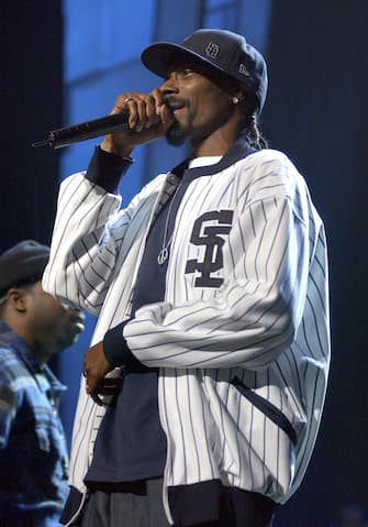 SNOOP DOGGPerforms live at 102.7Ã s KIIS-FMÃ s 4th Annual Jingle Ball held at The Pond of Anaheim in Anaheim, California, USA, December 4th 2004.half length gig on stage concert hat cap baseball topRef: DVSwww.capitalpictures.comsales@capitalpictures.comÂ©Capital Pictures