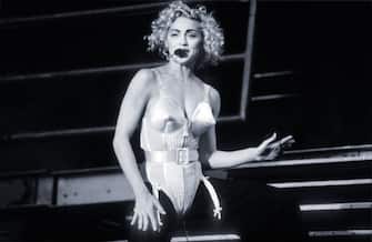 Madonna, Blonde Ambition Tour, She is wearing a Jean Paul Gaultier conical bra corset, Feyenoord Stadion, De Kuip, Rotterdam, Netherlands, 24 July 1990. (Photo by Gie Knaeps/Getty Images)