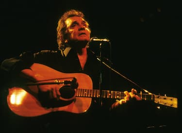 ROTTERDAM, HOLLAND - JUNE 30:  Johnny Cash performs on stage at the Nighttown in Rotterdam. Netherlands on June 30 1994. (Photo by Rob Verhorst/Redferns)