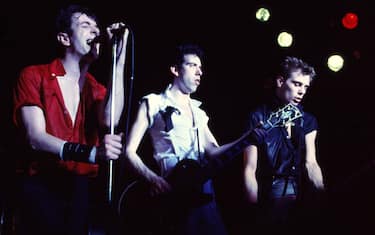 Members of British Punk group the Clash perform onstage at the Capitol Theatre, Passaic, New Jersey, March 8, 1980. Pictured are, from left, Joe Strummer (born John Graham Mellor, 1952 - 2002), Mick Jones, on guitar, and Paul Simonon, on bass. (Photo by Gary Gershoff/Getty Images)