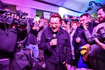 Ukraine, Bono and The Edge in Kiev sing for peace in a surprise concert.  PHOTO