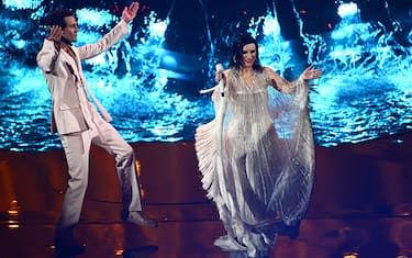 Lebanese-born British singer-songwriter, Mika (L) and Italian singer Laura Pausini perform "Fragile" during the second semifinal of the Eurovision Song contest 2022 on May 12, 2022 at the Pala Alpitour venue in Turin. (Photo by Marco BERTORELLO / AFP) (Photo by MARCO BERTORELLO/AFP via Getty Images)