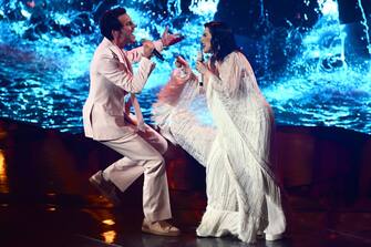 Lebanese-born British singer-songwriter, Mika (L) and Italian singer Laura Pausini perform during the second semifinal of the Eurovision Song contest 2022 on May 12, 2022 at the Pala Alpitour venue in Turin. (Photo by Marco BERTORELLO / AFP) (Photo by MARCO BERTORELLO/AFP via Getty Images)