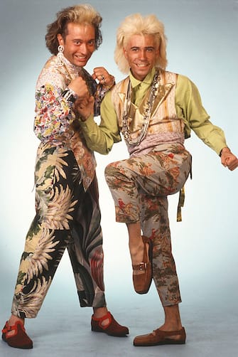 Italian singers Stefano Rota and Stefano Righi, members of the band Righeira, posing amused wearing eccentric clothes.  Italy, 1985 (Photo by Angelo Deligio / Mondadori via Getty Images)