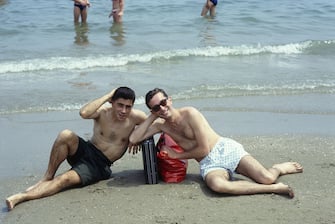 The duo formed by Michael (Stefano Rota) and Johnson (Stefano Righi) I Righeira posing by the sea.  1983 (Photo by Angelo Deligio  Mondadori via Getty Images)