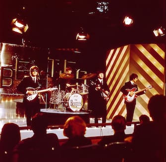From left, John Lennon (playing his second Rickenbacker 325 guitar), Ringo Starr, Paul McCartney (playing his Hofner 500/1 violin bass guitar) and George Harrison (playing his 1963 Rickenbacker 360/12 guitar)of English rock and pop group The Beatles perform together on stage for the ABC Television music television show 'Thank Your Lucky Stars' Summer Spin at Teddington Studios in London on 11th July 1964. The band would go on to play four songs on the show, A Hard Day's Night, Long Tall Sally, Things We Said Today and You Can't Do That. (Photo by David Redfern/Redferns)