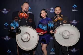 MEXICO CITY, MEXICO - NOVEMBER 10: Pepe Aguilar with the Tribute To The Greats of Mexico Award, Ã ngela Aguilar with the Female Artist Of The Year Award and Latin Pride Award and Mariachi Song Of The Year and Leonardo Aguilar pose backstage at Expo Santa Fe MÃ©xico on November 10, 2021 in Mexico City, Mexico. (Photo by Victor Chavez/Getty Images for Estrella Media)