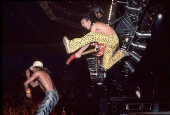 SAN DIEGO, CALIFORNIA - MAY 21: David Lee Roth (L) and Eddie Van Halen of Van Halen perform on May 21, 1984 in San Diego, California.  (Photo by Kevin Winter / Getty Images)