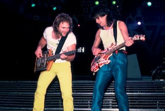 Rock musicians Michael Anthony and Eddie Van Halen (1955 - 2020), both of the group Van Halen, perform onstage at the Metro Center, Rockford, Illinois, March 16, 1986. (Photo by Paul Natkin / Getty Images)