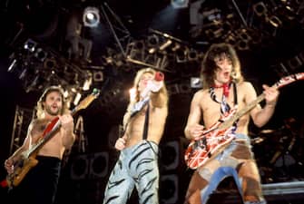 DETROIT, MI - APRIL 5: (LR) American guitarist Michael Anthony, American rock musician, songwriter and lead singer David Lee Roth and American musician, songwriter, producer, and inventor Eddie Van Halen (1955-2020), of the American rock band Van Halen, perform on stage during Van Halen's 