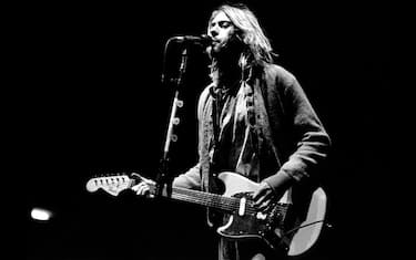 ITALY - FEBRUARY 21: Kurt Cobain performing live onstage at Palasport, Modena, playing Fender Mustang guitar.  (Photo by Raffaella Cavalieri/Redferns)