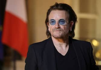 Irish lead singer of rock band U2, Paul David Hewson aka Bono delivers a statement in the courtyard of the Elysee Palace, in Paris, after a meeting with French President, on September 10, 2018. - Emmanuel Macron received U2 singer Bono, co-founder of the NGO One, to discuss aid development and a partnership between Europe and Africa. (Photo by ludovic MARIN / AFP)        (Photo credit should read LUDOVIC MARIN/AFP via Getty Images)