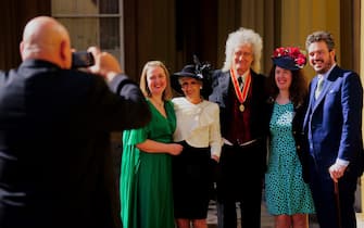 Sir Brian May poses with his family, including wife Anita Dobson, after being made a Knight Bachelor by King Charles III during an investiture ceremony at Buckingham Palace, London. Picture date: Tuesday March 14, 2023. PA Photo. See PA story ROYAL Investiture. Photo credit should read: Victoria Jones/PA Wire 