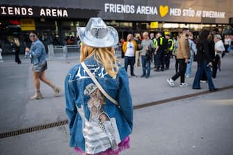 A fan of US musician Beyonce poses with her hand made jacket as she about to enter to the Friends Arena to watch her first concert of the World Tour named 