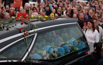 Fans of singer Sinead O'Connor line the streets for a 