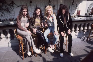 8th September 1976:  British rock group Queen at Les Ambassadeurs, where they were presented with silver, gold and platinum discs for sales in excess of one million of their hit single 'Bohemian Rhapsody'. The band are, from left to right, John Deacon, Freddie Mercury (Frederick Bulsara, 1946 - 1991), Roger Taylor and Brian May.  (Photo by Keystone/Getty Images)