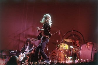 1977:  Rock group Led Zeppelin performing on stage. From left to right: Jimmy Page, Robert Plant and John Bonham (1947 - 1980).  (Photo by Hulton Archive/Getty Images)