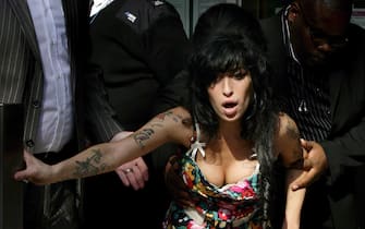 Amy Winehous supported by some vigilantes