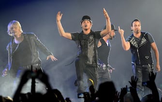 GERMANY MUSIC epa03209892 Singers Nick Carter (L-R), Brian Littrell, Alexander James (AJ) McLean and Howie Dorough of US boy band the Backstreet Boys perform together during their NKOTBSB Tour concert with US boygroup the New Kids on the Block at the o2 world in Berlin, Germany, 07 May 2012. EPA/BRITTA PEDERSEN