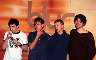 Pop group Blur (l-r) Graham Coxon (lead guitar), Damon Albarn (vocals, keyboard), Dave Rowntree (drums) and Alex James (bass) pictured today (Mon) at the Cafe Royal in London to mark the release of a new record.   * 7/3/01: David and Helen Balfe , a husband-and-wife team who originally signed up  the group won a  250,000 royalties claim against EMI Records at the High  Court in London.   (Photo by John Stillwell - PA Images/PA Images via Getty Images)