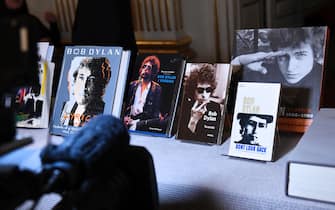 A cameraman films books by US songwriter Bob Dylan who was announced the laureate of the 2016 Nobel Prize in Literature at the Swedish Academy in Stockholm, Sweden, on October 13, 2016.
US songwriter Bob Dylan wins the 2016 Nobel Literature Prize. / AFP / JONATHAN NACKSTRAND        (Photo credit should read JONATHAN NACKSTRAND/AFP via Getty Images)
