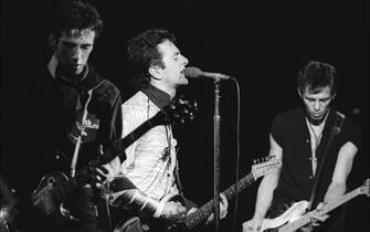 Members of the British Punk group the Clash perform onstage at the Palladium, New York, New York, September 20, 1979. Pictured are, from left, Mick Jones and Joe Strummer (1952 - 2002), both on guitar, and Paul Simonon, on bass. (Photo by Allan Tannenbaum/Getty Images)