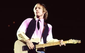 American Rock and Pop musician Tom Petty (1950 - 2017) plays guitar as he leads his band, the Heartbreakers, during a performance on the 'Long After Dark' tour at Nassau Coliseum, Uniondale, New York, March 31,1983. (Photo by Gary Gershoff/Getty Images)
