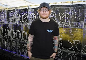 epa06571804 British singer-songwriter Ed Sheeran poses for a photograph in front of an ice sculpture after meeting members of the media at Optus Stadium in Perth, Western Australia, Australia, 01 March 2018. Sheeran will start his Australian and New Zealand leg of his Divide tour at Optus Stadium in Perth on 02 March.  EPA/RICHARD WAINWRIGHT  AUSTRALIA AND NEW ZEALAND OUT