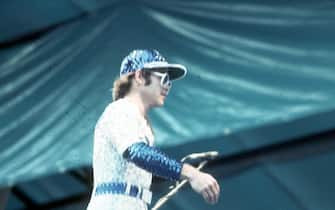 LOS ANGELES - OCTOBER 25:  Pop singer Elton John performs onstage at Dodger Stadium in a blue and white sequined outfit Dodgers uniform on October 25, 1975 in Los Angeles, California. (Photo by Michael Ochs Archives/Getty Images)