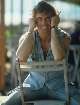 Italian singer-songwriter Franco Califano sitting on a chair holding a cigarette. 1981  (Photo by Rino Petrosino\Mondadori via Getty Images)