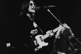 British musician John Lennon (1940 - 1980) performs onstage in Madison Square Garden, New York, New York, November 28, 1974. (Photo by New York Times Co./Larry C. Morris/Getty Images)