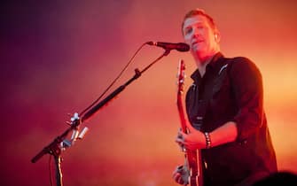 epa06382497 (FILE) - US Singer Josh Homme and his band Queens of The Stone Age perform during a concert at the 22nd Sziget (Island) Festival on the Shipyard Island in northern Budapest, Hungary, 12 August 2014. The festival, one of the biggest cultural events of Europe offering art exhibitions, theatrical and circus performances and above all music concerts during a week runs until 18 August (reissued 11 December 2017). According to news reports, Josh Homme has apologized to a female photographer he had allegedly kicked in the head during a concert in Los Angeles, USA on 09 December 2017.  EPA/BALAZS MOHAI HUNGARY OUT