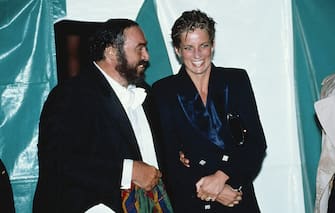 Princess Diana, with wet hair, talking to Italian tenor Luciano Pavarotti at a concert in Hyde Park, London, 30th July 1991. (Photo by Princess Diana Archive/Getty Images)