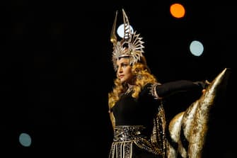 INDIANAPOLIS, IN - FEBRUARY 05:  Singer Madonna performs during the Bridgestone Super Bowl XLVI Halftime Show at Lucas Oil Stadium on February 5, 2012 in Indianapolis, Indiana.  (Photo by Rob Carr/Getty Images)