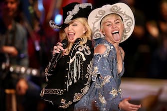 HOLLYWOOD, CA - JANUARY 28:  Madonna and Miley Cyrus perform onstage during Miley Cyrus: MTV Unplugged at Sunset Gower Studios on January 28, 2014 in Hollywood, California. Miley Cyrus: MTV Unplugged premieres on January 29, 2014 on MTV at 9/8 PM. (Photo by Christopher Polk/Getty Images for MTV)