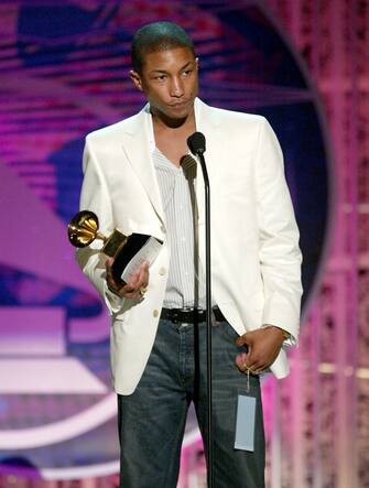 LOS ANGELES - FEBRUARY 8:  Musical Artist Pharrell Williams accepts The Neptunes Award for Producer of the Year, Non-Classical at the 46th Annual Grammy Awards held at the Staples Center on February 8, 2004 in Los Angeles, California.  (Photo by Frank Micelotta/Getty Images)