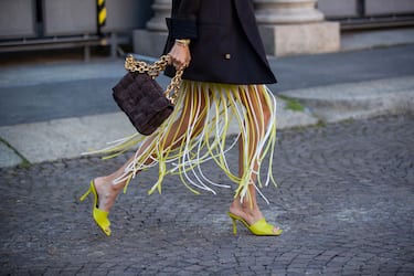 MILAN, ITALY - SEPTEMBER 26: Leonie Hanne seen wearing yellow dress with fringes, black blazer, bag, heels outside Ports 1961 during the Milan Women's Fashion Week on September 26, 2020 in Milan, Italy. (Photo by Christian Vierig/Getty Images)