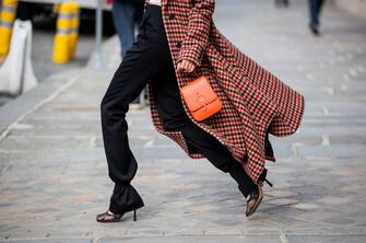 PARIS, FRANCE - OCTOBER 08: Leonie Hanne is seen wearing J.W. Anderson checkered red coat, red J.W. Anderson bag, white Dion Lee top, black  J.W. Anderson pants, Bottega Veneta heels during a Street Style Fashion Photo Session on October 08, 2020 in Paris, France. (Photo by Christian Vierig/Getty Images)