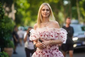 PARIS, FRANCE - JULY 01: Chiara Ferragni wears an off-shoulder ruffled lace dress with printed red lips, outside Giambattista Valli, during Paris Fashion Week -Haute Couture Fall/Winter 2019/2020, on July 01, 2019 in Paris, France. (Photo by Edward Berthelot/Getty Images)