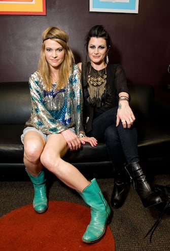 LOS ANGELES, CA - APRIL 01:  Musicians Leisha Hailey (L) and Camila Grey of Uh Huh Her pose backstage before their performance at The El Rey Theatre on April 1, 2011 in Los Angeles, California.  (Photo by Amanda Edwards/Getty Images)