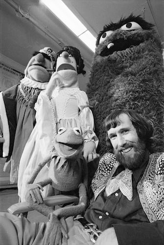 (Original Caption) New York: Jim Henson, creator of the merry and memorable Muppet puppets, poses with a few of his creations recently. The puppets have been a major factor in the sucess of the "Sesame Street" children's TV series. Now they will star in "Tales From Muppetland," a special sponsored by Reynolds Foods, Inc. Henson, who is directing the show, has created several new Muppets for the special. "Tales From Muppetland" is a witty version of the old Cinderella story and will be shown Apr. 10 on ABC. 3/6/1970