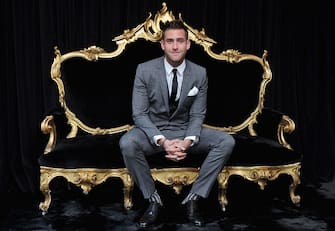 MILAN, ITALY - JANUARY 14:  Oliver Jackson-Cohen   poses in the VIP room at the Dolce & Gabbana show as part of the Milan Fashion Week Menswear Autumn/Winter 2012 at Metropol on January 14, 2012 in Milan, Italy.  (Photo by Venturelli/WireImage)