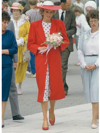 Diana, Princess of Wales  (1961 - 1997) wearing a red coat by Jan Van Velden during a visit to Atlantic College in Llantwit Major, Wales, June 1985.   (Photo by Jayne Fincher/Princess Diana Archive/Getty Images)