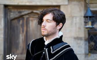 These images are under embargo until w/c 11th January

In the present day, Domenico finds a brutalised body in Oxford and suspects a mysterious affliction called blood rage has returned. In 1590, Matthew is forced to beg forgiveness from Father Hubbard for executing Tom Caldwell – the sort of conflict he had hoped to avoid. Diana and Matthew are introduced to John Dee by Mary Sidney. They explore his library, hoping to find clues to the whereabouts of the Book of Life. Dee tells them his scryer Edward Kelley stole a valuable book from him and is now hiding in Bohemia, and Matthew and Diana suspect it must be the
Book of Life. Goody Alsop teaches Diana about weaving and knots, and
Diana is overwhelmed to discover a new world of magic open up to her. In
the present, Em practises higher magic to try and reach Diana’s mother,
Rebecca, in order to help her niece get closer to the Book. Matthew
suspects that Kit has betrayed Diana’s identity to Cecil. A cautious Matthew
and Diana meet with Queen Elizabeth I, who accuses Matthew of betraying
her by marrying Diana. As a test of loyalty, she orders them to bring Edward
Kelley home from the clutches of King Rudolf, so that she can claim the
Philosopher’s Stone, the secret to eternal life which Kelley had promised.
Before they can leave however, Gallowglass arrives with a message from
Matthew’s father Philippe – summoning Matthew and Diana to France.