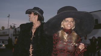 American rock drummer Tommy Lee and his wife, Canadian actress Pamela Anderson attend the 24th Annual American Music Awards, held at the Shrine Auditorium in Los Angeles, California, 27th January 1997. (Photo by Vinnie Zuffante/Michael Ochs Archives/Getty Images)