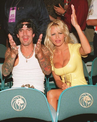 8/19/.95.Las Vegas. Tommy Lee and Pamela Anderson wave at the Mike Tyson fight at Ceasars Palace. Photo James Aylott Online USA Inc